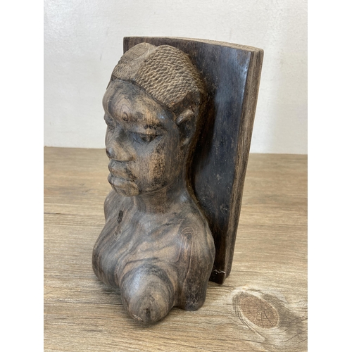 565 - A pair of African carved rosewood figural book ends - approx. 21cm high x 12cm deep