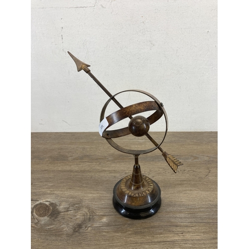 571 - An antique style patternated metal desktop armillary sphere - approx. 28.5cm high