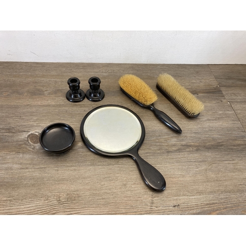 574 - A vintage Ebony six piece dressing table set