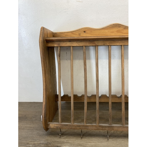 577 - A Victorian style pine wall hanging plate rack - approx. 61cm wide x 40cm high