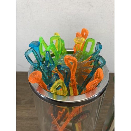 579 - A large collection of vintage plastic cocktail stirrers