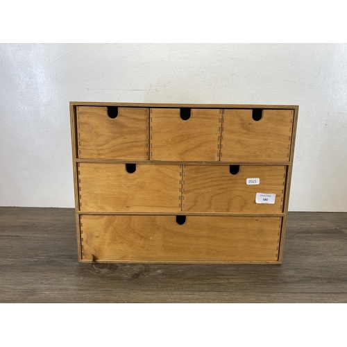 580 - A modern plywood six drawer table top cabinet - approx. 32cm high x 42cm wide x 19cm deep