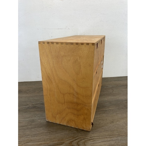 580 - A modern plywood six drawer table top cabinet - approx. 32cm high x 42cm wide x 19cm deep