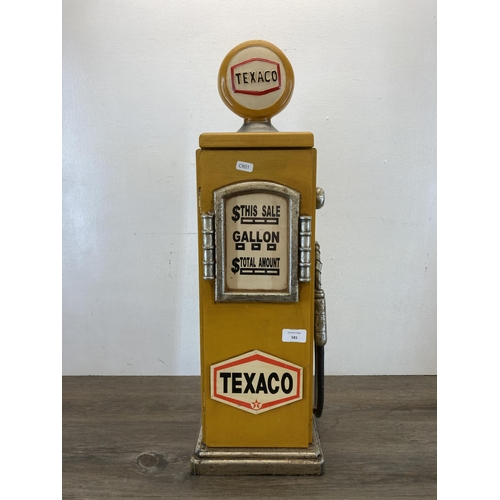 581 - A novelty painted wooden Texaco petrol pump floor standing CD rack - approx. 66cm high