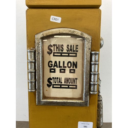 581 - A novelty painted wooden Texaco petrol pump floor standing CD rack - approx. 66cm high