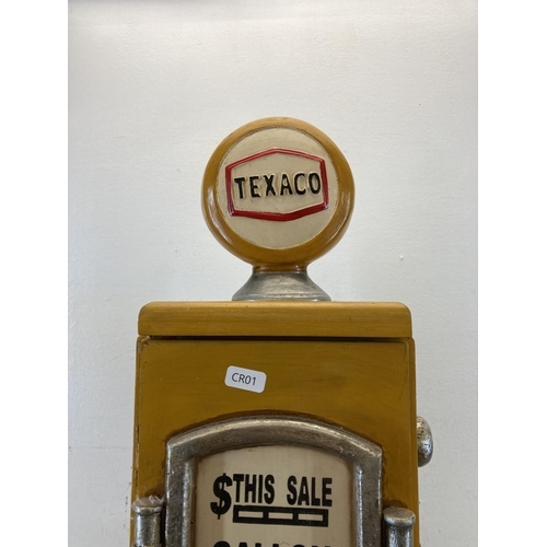 581 - A novelty painted wooden Texaco petrol pump floor standing CD rack - approx. 66cm high