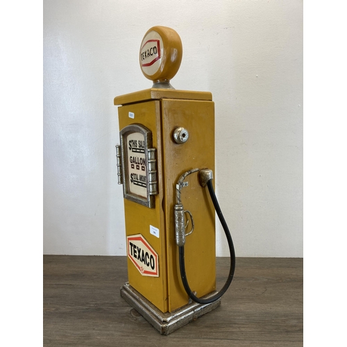 581 - A novelty painted wooden Texaco petrol pump floor standing CD rack - approx. 66cm high