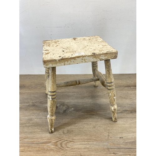 583 - A 19th century painted pine farmhouse stool - approx. 36cm high