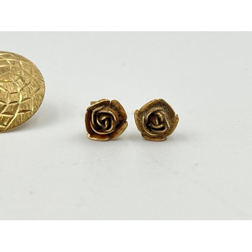 2414 - Five pieces of jewellery, one 9ct gold earring, two 9ct gold floral earrings and two yellow metal en... 