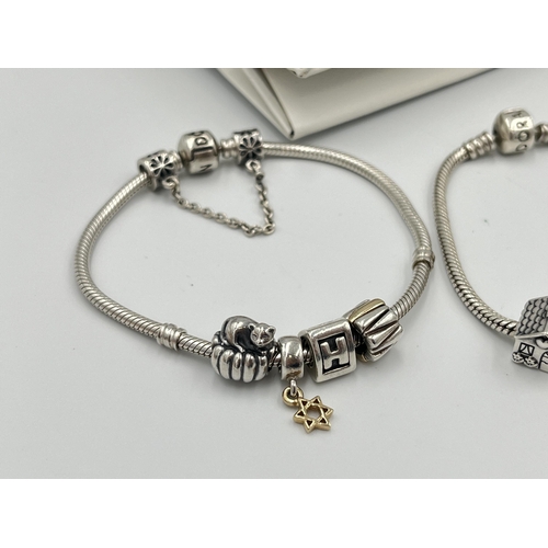 2416 - Four pieces of Pandora .925 silver jewellery, three charm bracelets with assorted charms and one pen... 