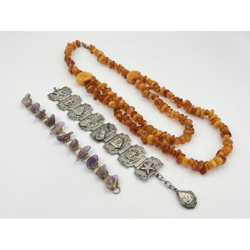 2469 - Three pieces of jewellery, one vintage amber beaded necklace, one amethyst and white metal bracelet ... 