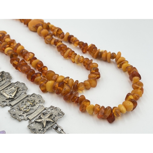 2469 - Three pieces of jewellery, one vintage amber beaded necklace, one amethyst and white metal bracelet ... 