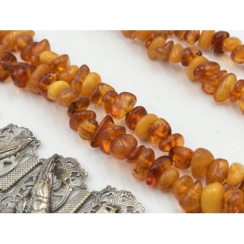 2469 - Three pieces of jewellery, one vintage amber beaded necklace, one amethyst and white metal bracelet ... 