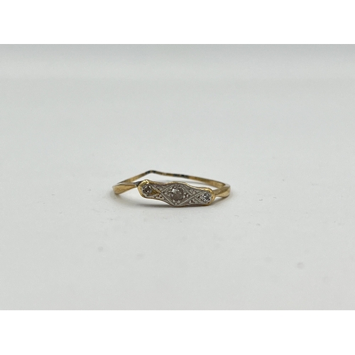 2475 - An 18ct gold diamond three stone ring - approx. gross weight 1.15g