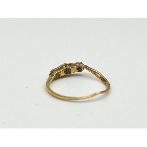 2475 - An 18ct gold diamond three stone ring - approx. gross weight 1.15g