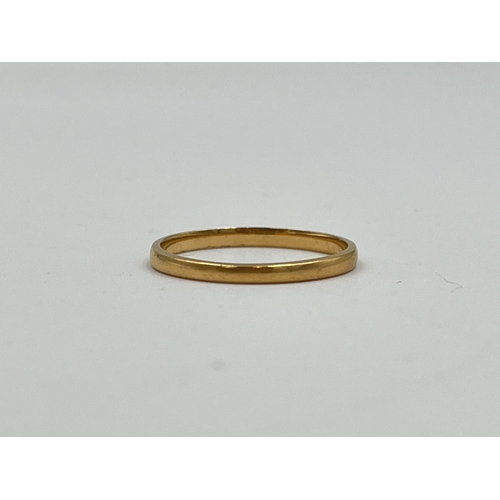 2477 - A hallmarked Birmingham 22ct gold wedding band, size L½ - approx. gross weight 1.4g