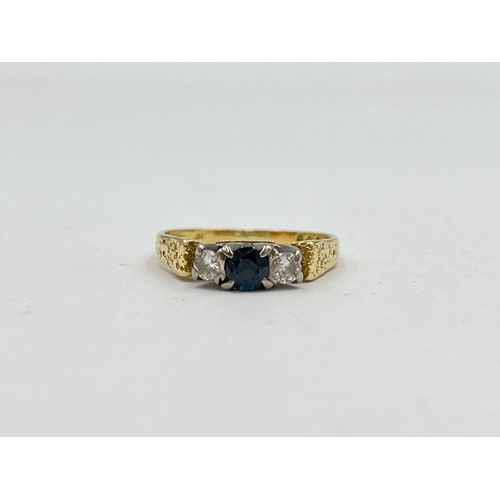 2479 - A hallmarked 18ct gold sapphire and diamond ring, size M½ - approx. gross weight 3.65g