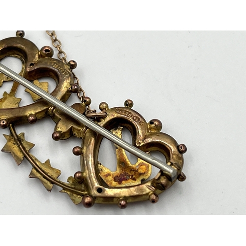 2483 - A Victorian hallmarked Birmingham 9ct gold double heart brooch with swallow and foliate design and b... 