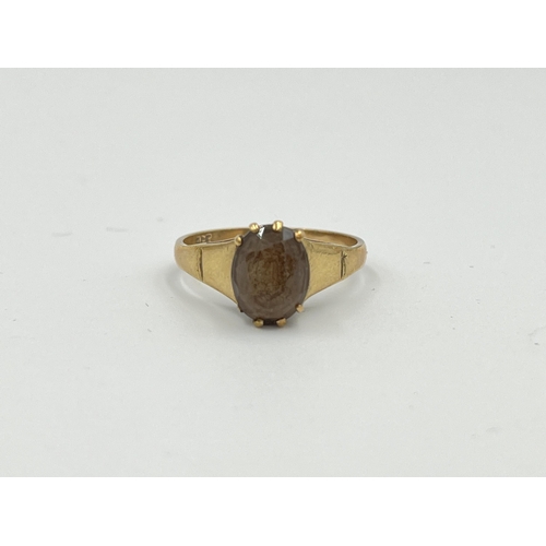 2493 - A 9ct gold smoky quartz solitaire ring, size O - approx. gross weight 2.46g