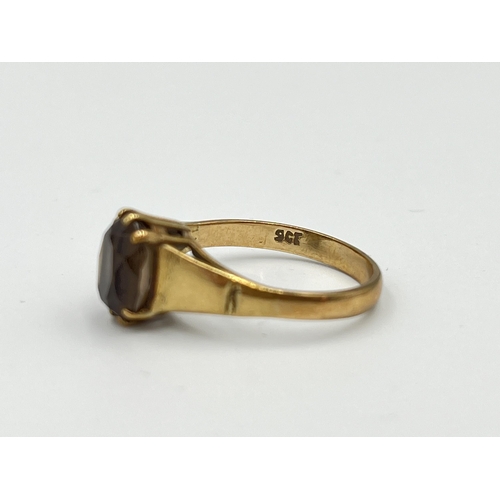 2493 - A 9ct gold smoky quartz solitaire ring, size O - approx. gross weight 2.46g