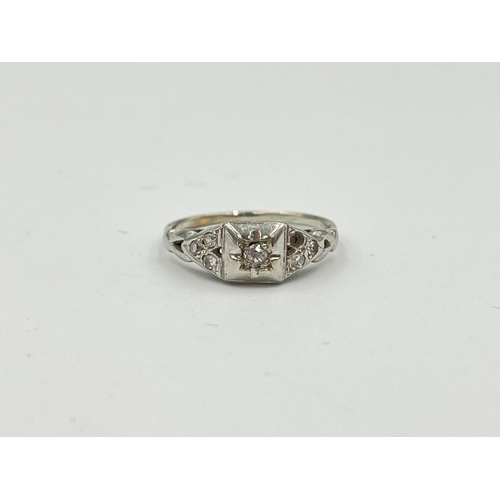 2494 - A 10ct white gold diamond ring, size M - approx. gross weight 2.13g