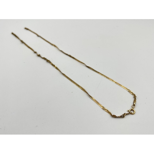 2507 - A hallmarked 9ct gold necklace for scrap - approx. gross weight 1.8g