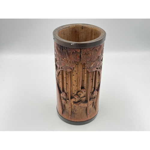 2317 - A Japanese heavily carved bamboo and brass rimmed brush pot