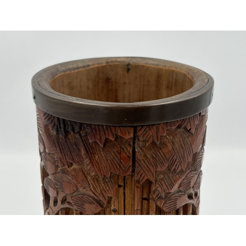 2317 - A Japanese heavily carved bamboo and brass rimmed brush pot