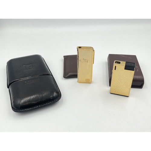 2318 - Three items of vintage tobacciana, one Ronson three section cigar holder, and two cased lighters; on... 