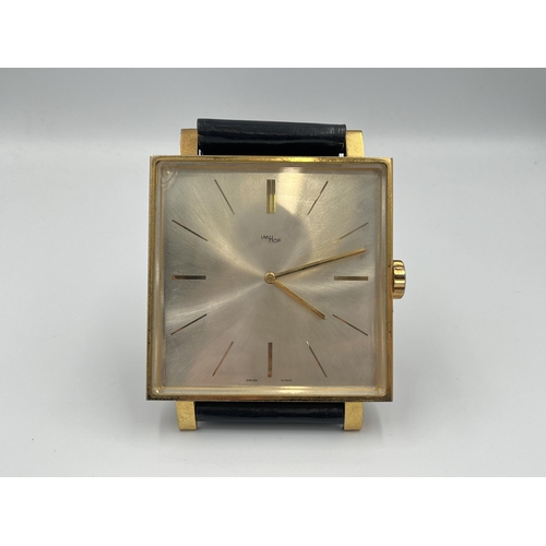 2333A - A vintage ImHof wall clock in the form of a wristwatch with swiss movement, numbered 1450762