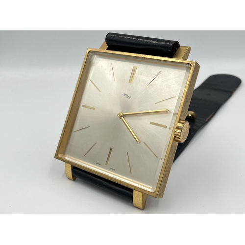 2333A - A vintage ImHof wall clock in the form of a wristwatch with swiss movement, numbered 1450762