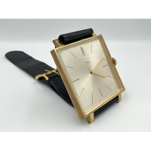 2333A - A vintage ImHof wall clock in the form of a wristwatch with swiss movement, numbered 1450762