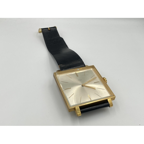 2333A - A vintage ImHof wall clock in the form of a wristwatch with swiss movement, numbered 1450762