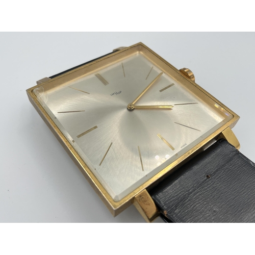 2333A - A vintage ImHof wall clock in the form of a wristwatch with swiss movement, numbered 1450762