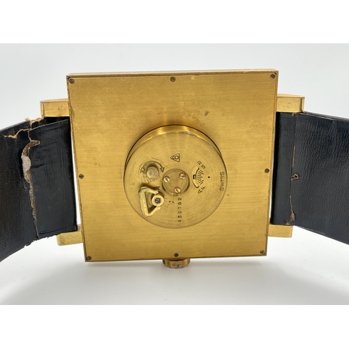 2333A - A vintage ImHof wall clock in the form of a wristwatch with swiss movement, numbered 1450762