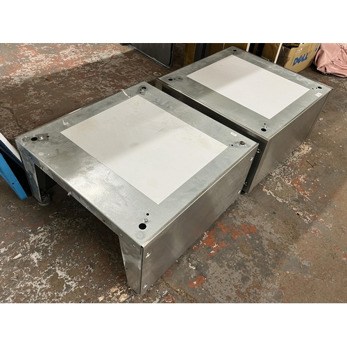 1052 - Two brushed steel stands