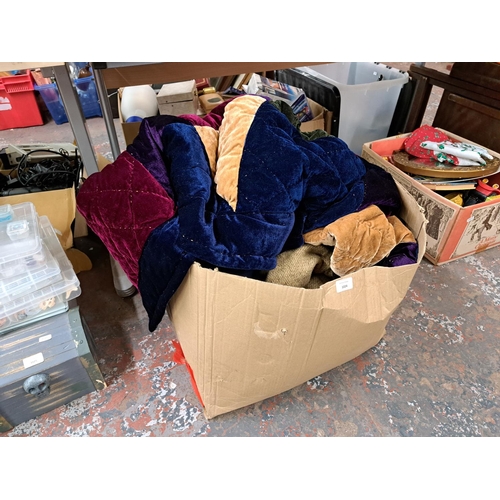 1024 - A box containing blankets and quilts