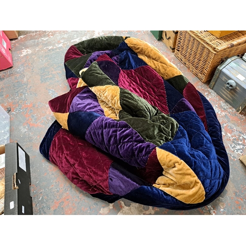 1024 - A box containing blankets and quilts