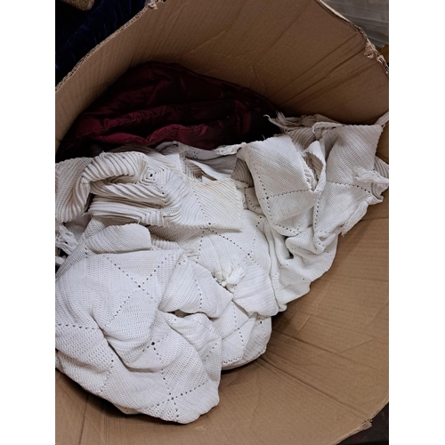 1024 - A box containing blankets and quilts