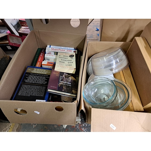 1026 - Four boxes containing books, kitchenware, key rings, large photo frame etc.