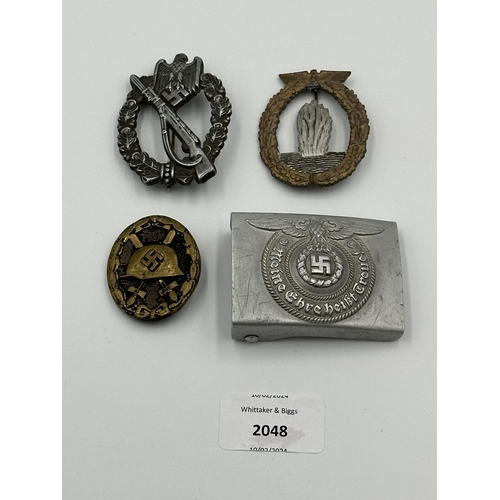 2048 - Four WWII German items, one Kriegsmarine Minesweeper badge with embossed stamp to reverse, one SS Of... 