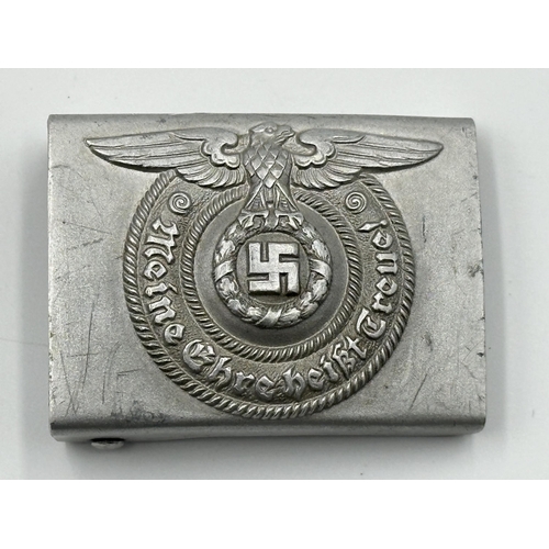 2048 - Four WWII German items, one Kriegsmarine Minesweeper badge with embossed stamp to reverse, one SS Of... 