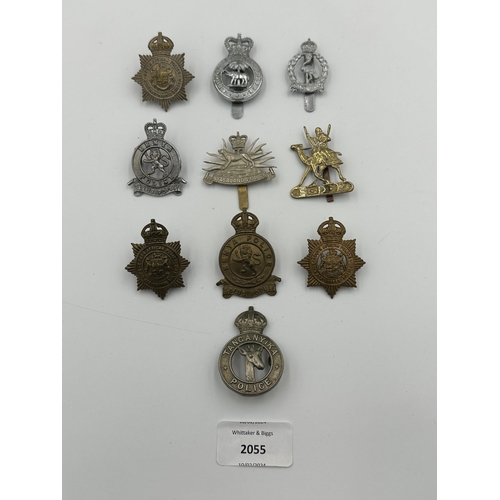 2055 - Ten military cap badges