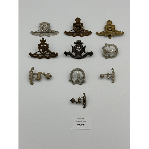 2057 - Ten military cap badges