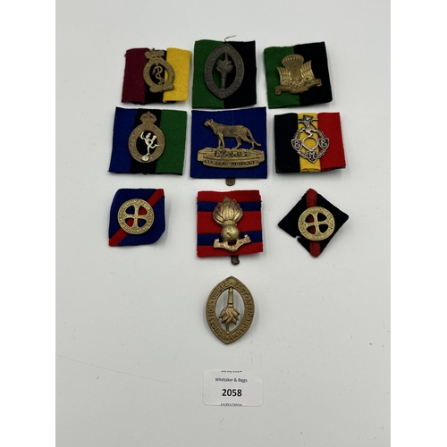 2058 - Ten military cap badges