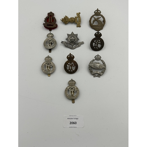 2060 - Ten military cap badges