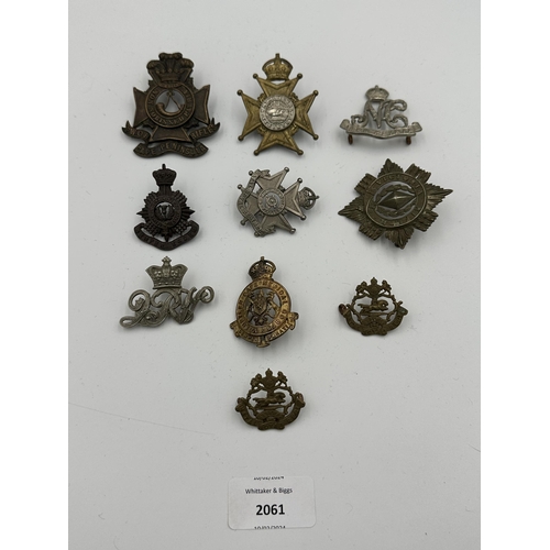 2061 - Ten military cap badges