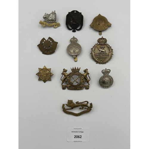 2062 - Ten military cap badges