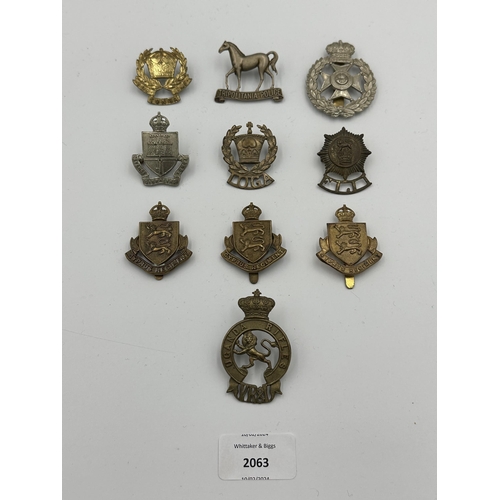 2063 - Ten military cap badges