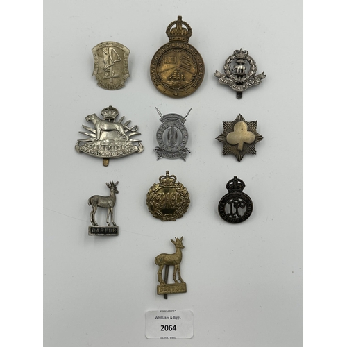 2064 - Ten military cap badges